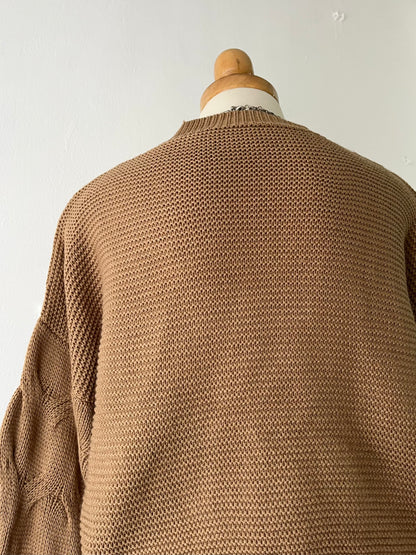 Knitted waist sweater with interwoven design