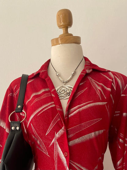 Red blouse with silver sparkles
