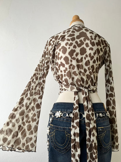 Wraparound animal print top with flared sleeves