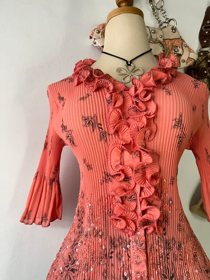 Coral top with embroidered designs