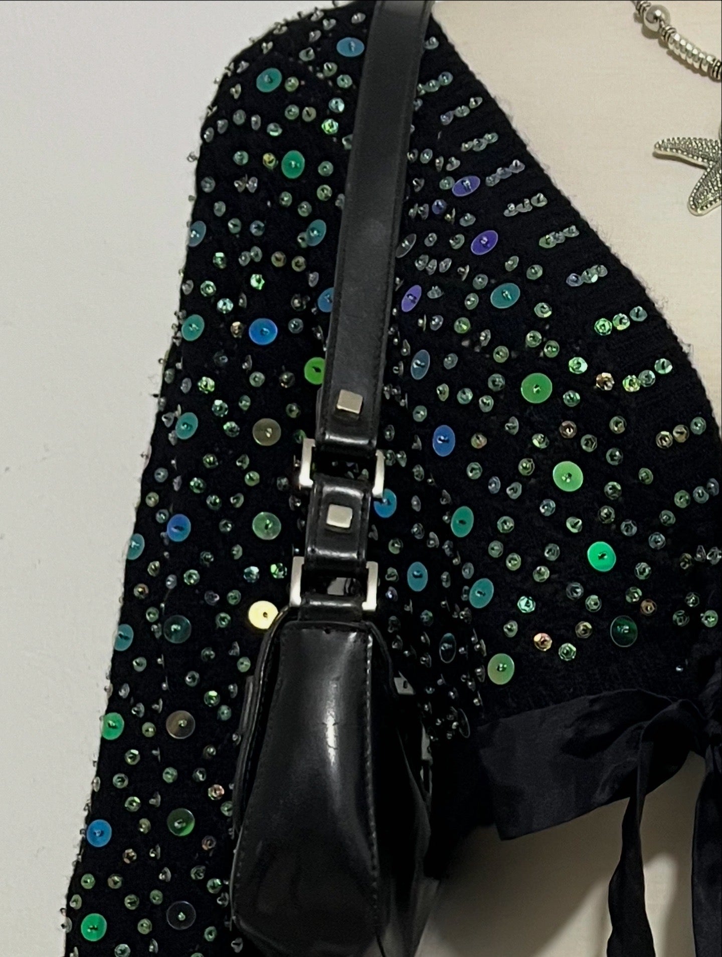 Knitted cardigan with sequins and bow