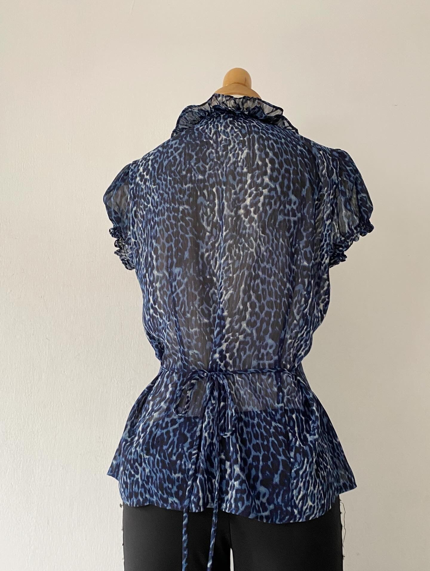 Cheetah print blouse with bow on the back