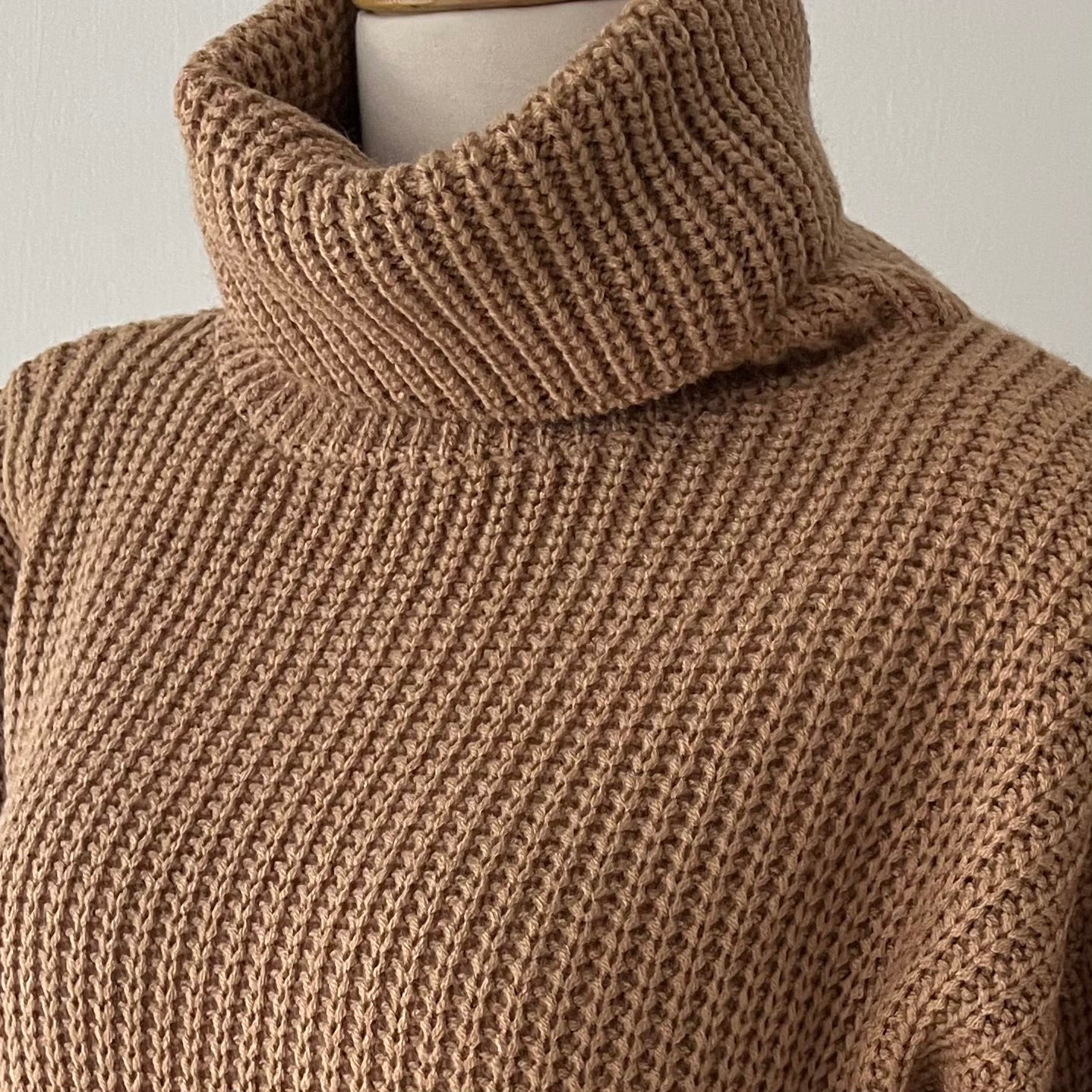 high-neck sweater with wide sleeves