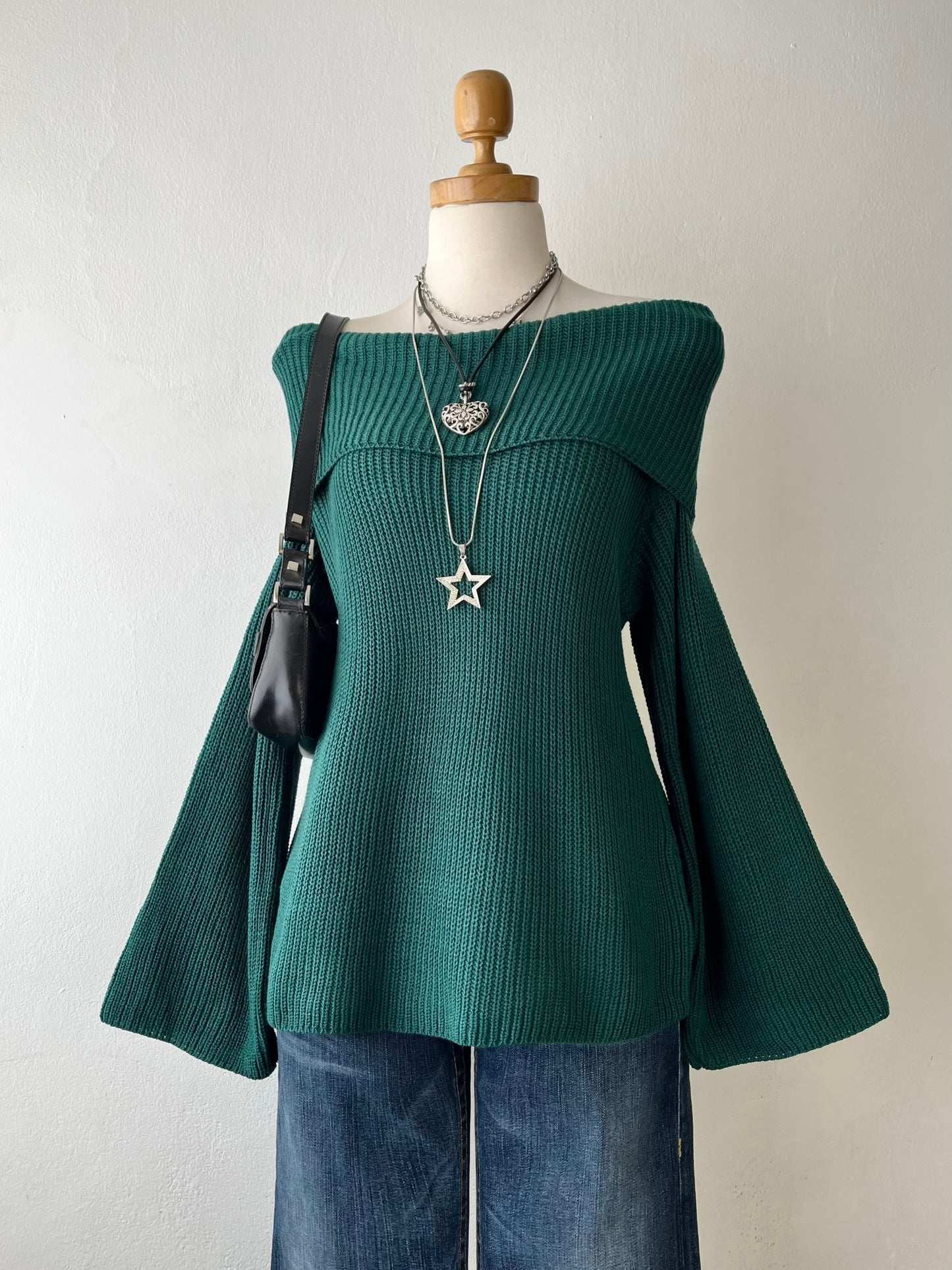 Green off-the-shoulder sweater with wide sleeves