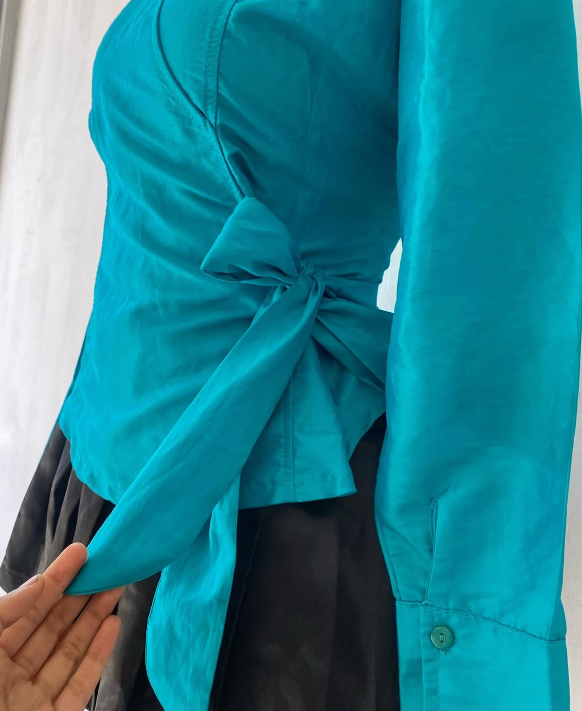 Turquoise blouse with bow