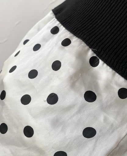 Polka dot top with knitted vest