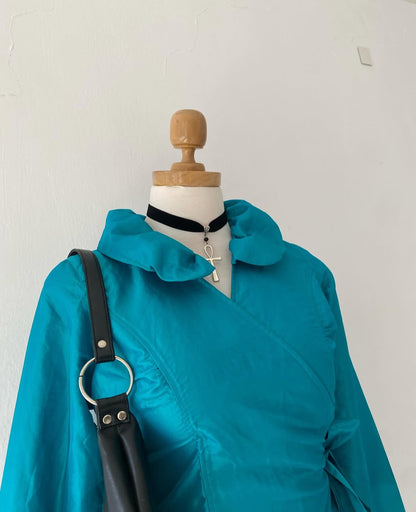 Turquoise blouse with bow
