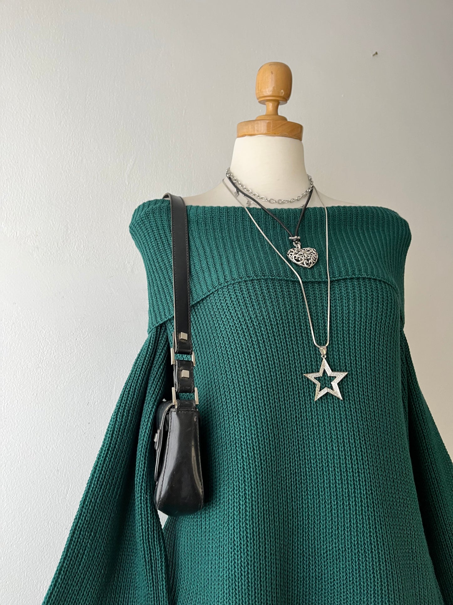 Green off-the-shoulder sweater with wide sleeves