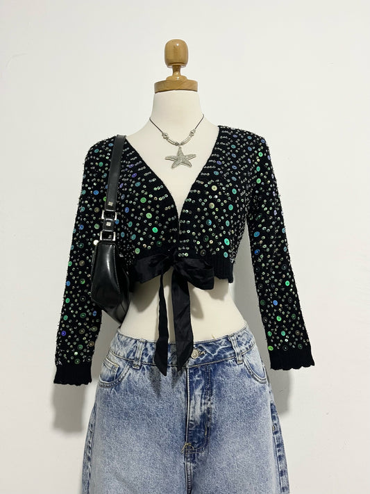 Knitted cardigan with sequins and bow