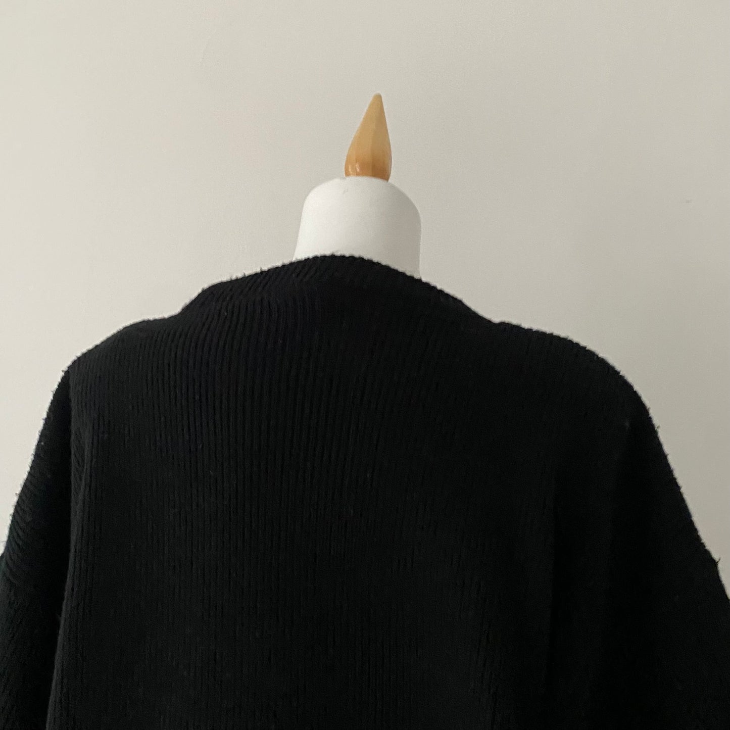 black sweater with animal print appliqués