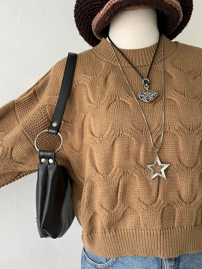 Knitted waist sweater with interwoven design
