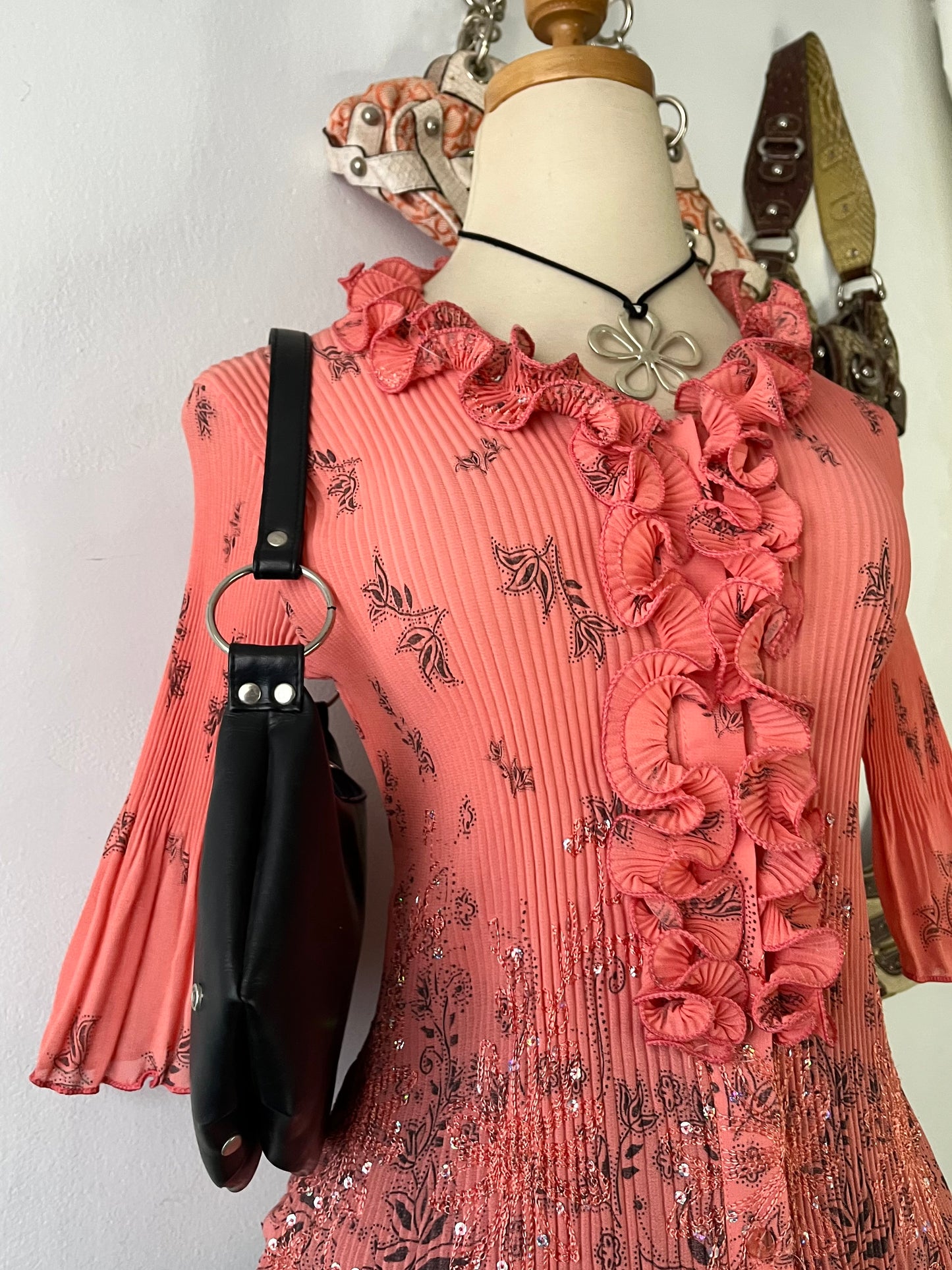 Coral top with embroidered designs