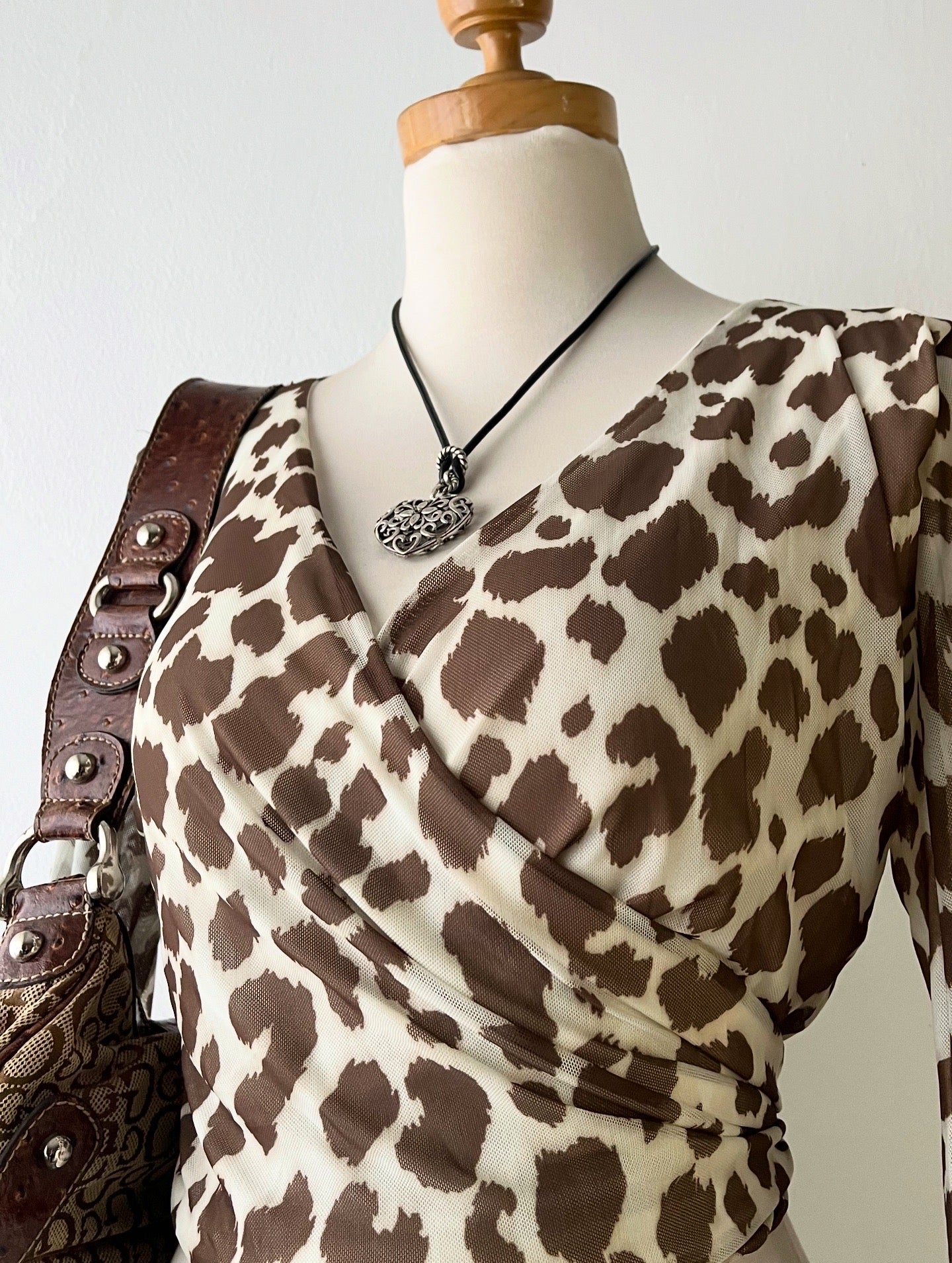 Wraparound animal print top with flared sleeves