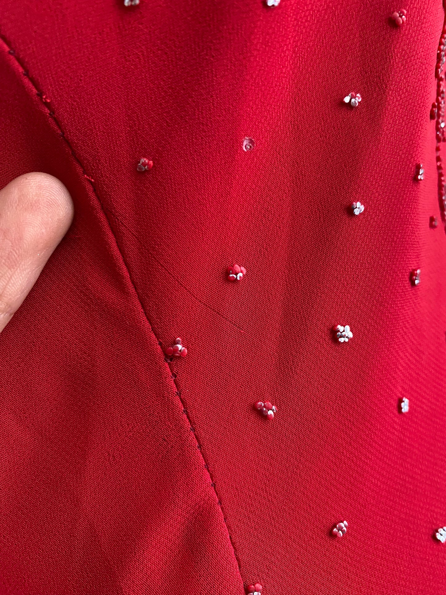 Red dress with silver appliqués