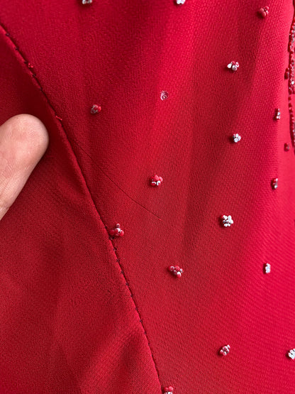 Red dress with silver appliqués