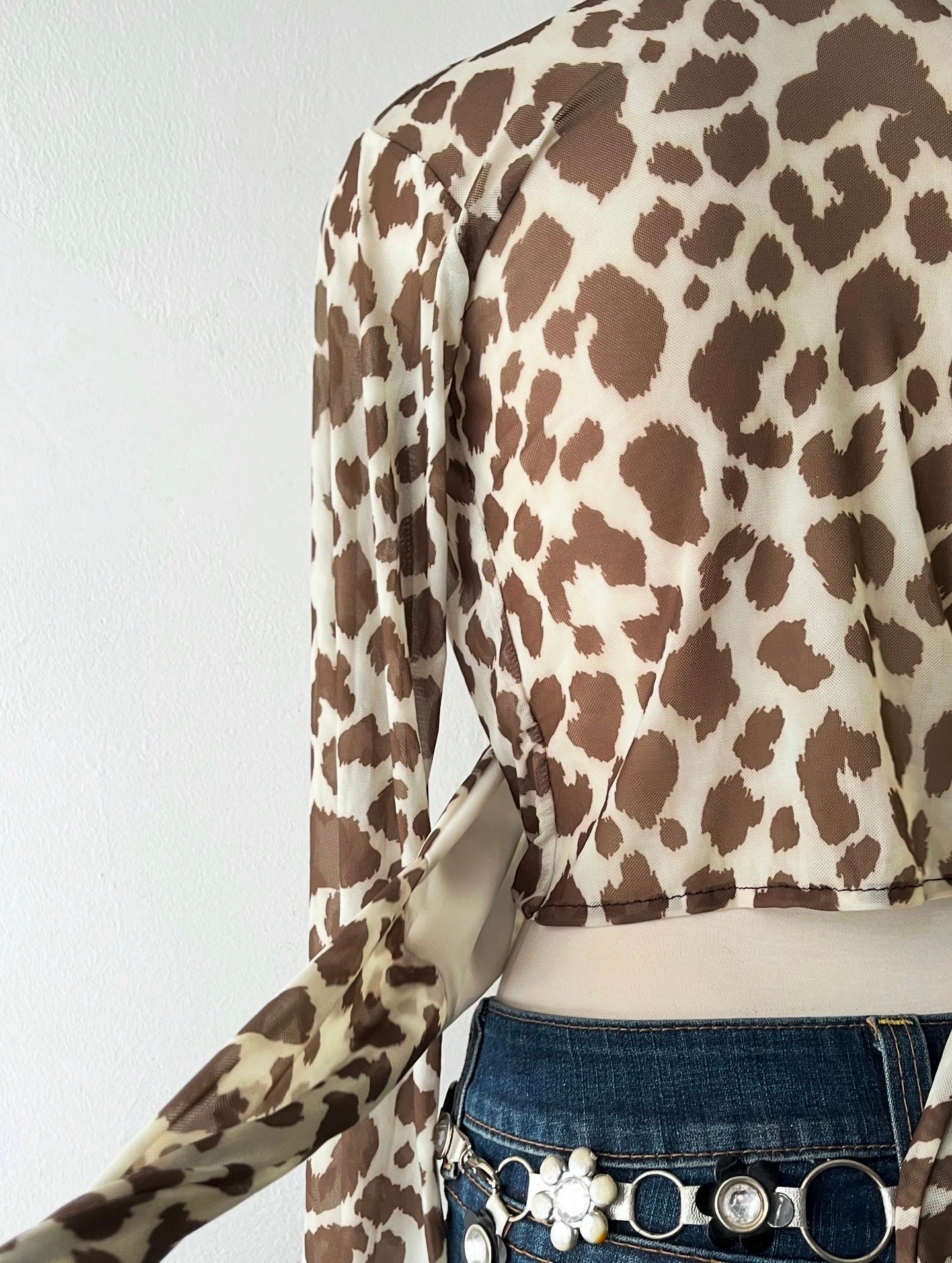 Wraparound animal print top with flared sleeves