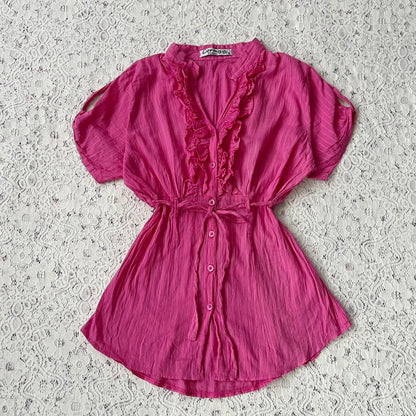 Pink blouse with a bow at the waist