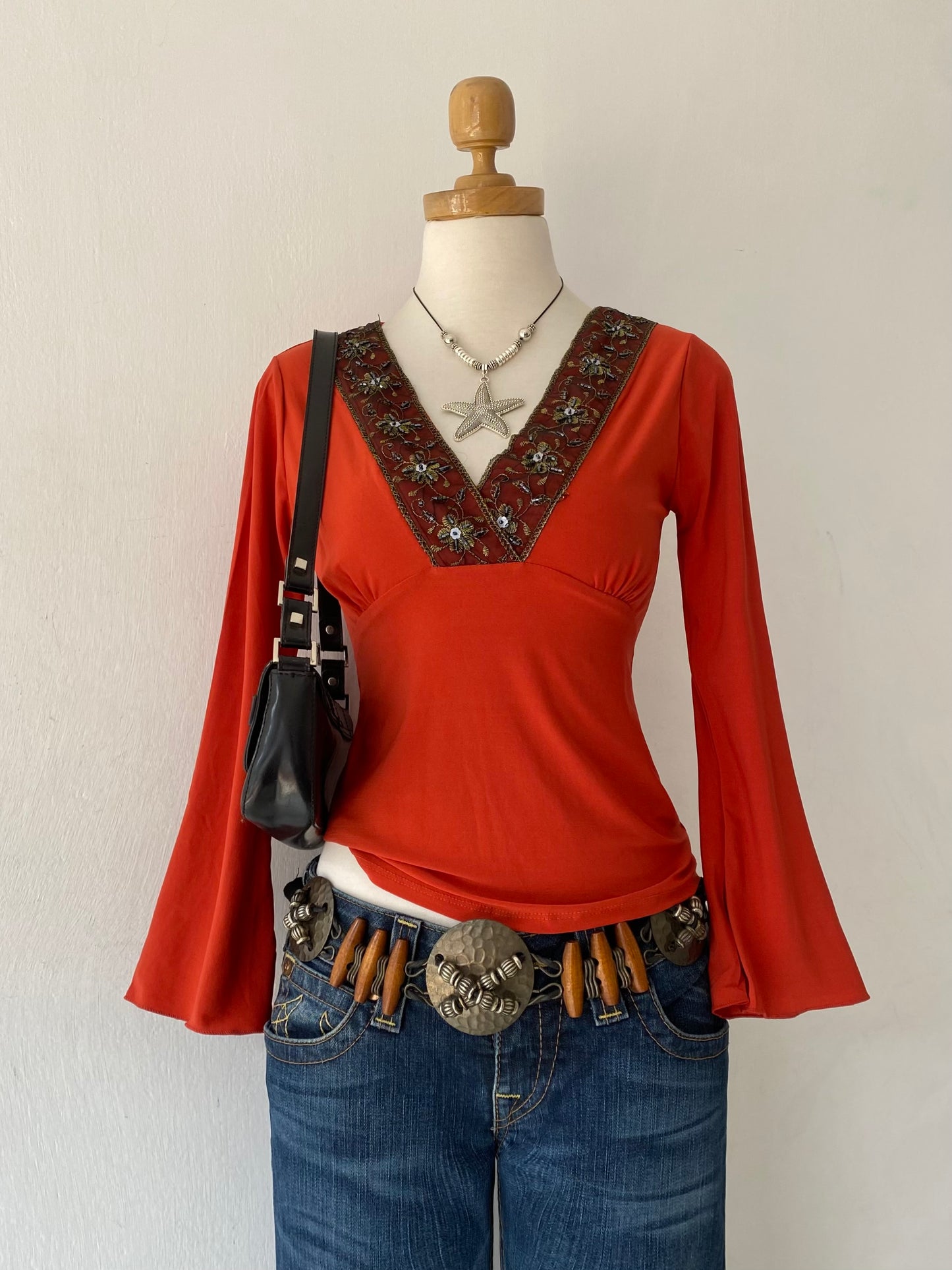 Bell-sleeved top