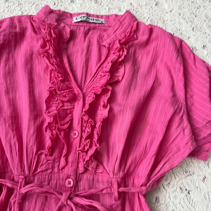 Pink blouse with a bow at the waist