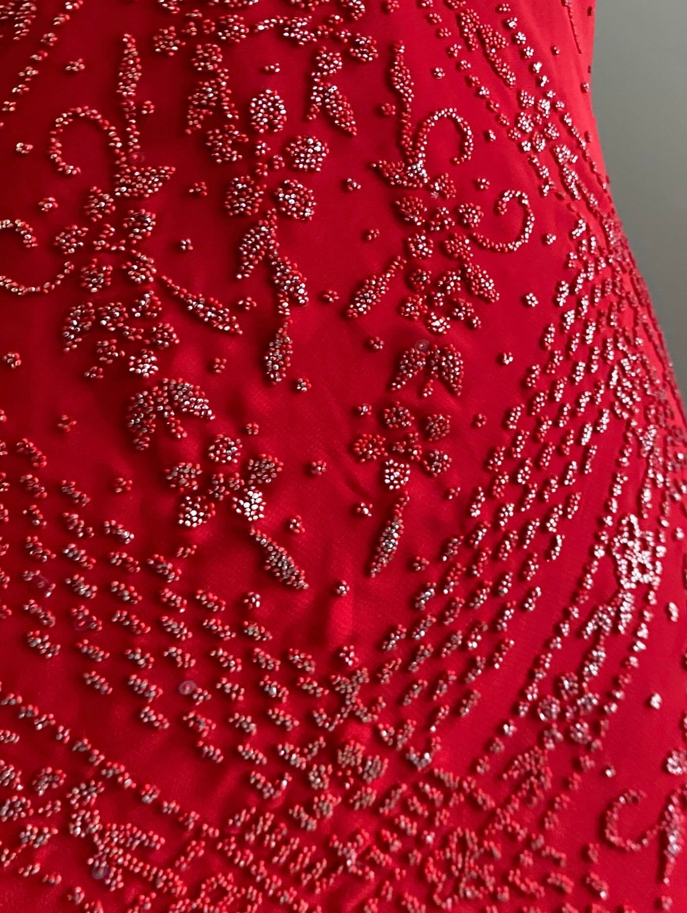 Red dress with silver appliqués