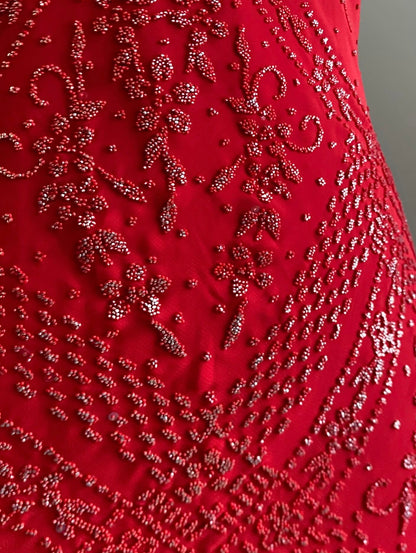 Red dress with silver appliqués