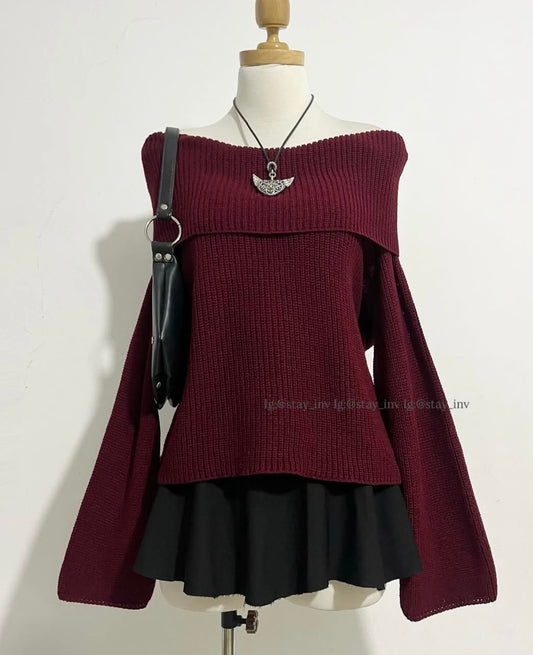 Oversized sweater with bell sleeves and bare shoulders