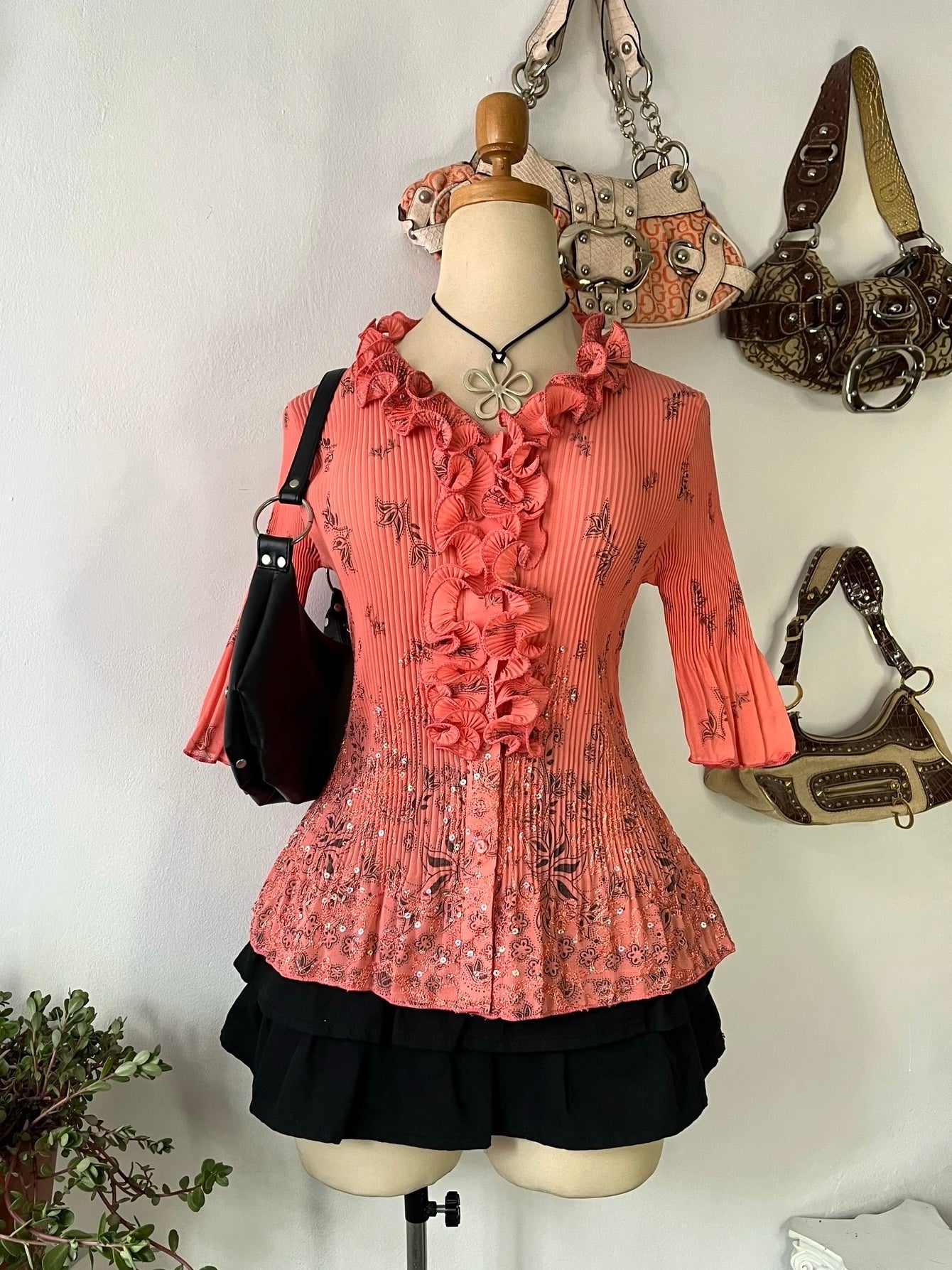 Coral top with embroidered designs