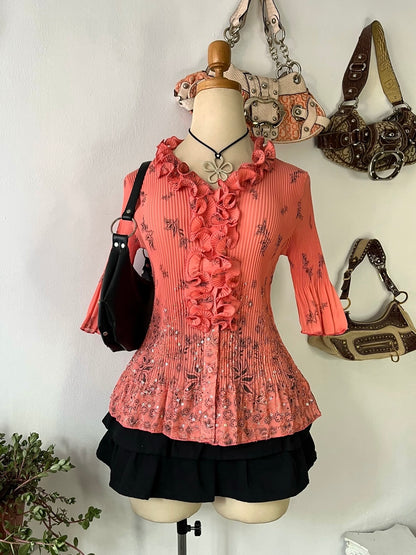 Coral top with embroidered designs