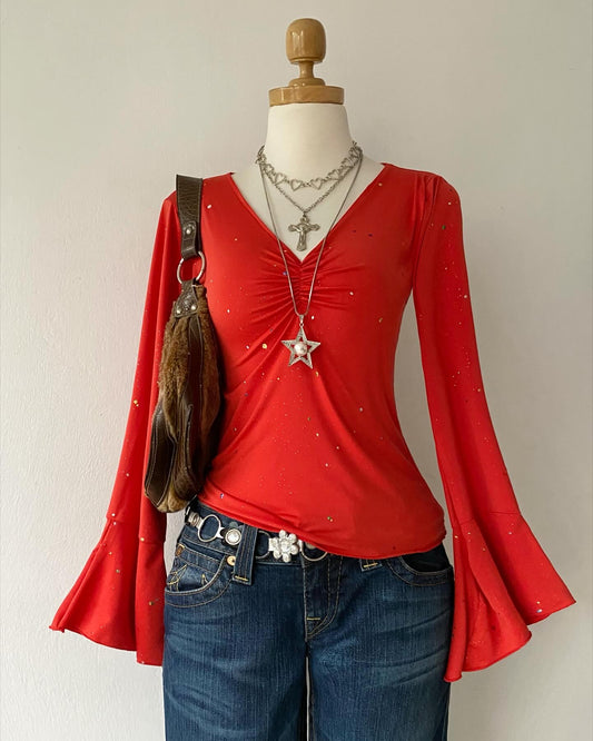 Bell-sleeved top with appliqués